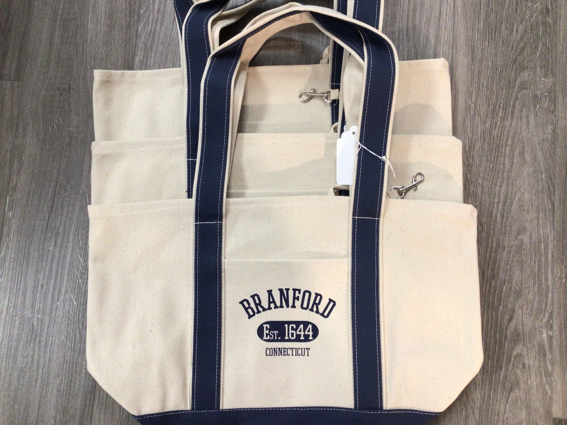 Branford canvas totes 18x18 with gussets. Heavy duty canvas with long straps that can be slung over your shoulder.