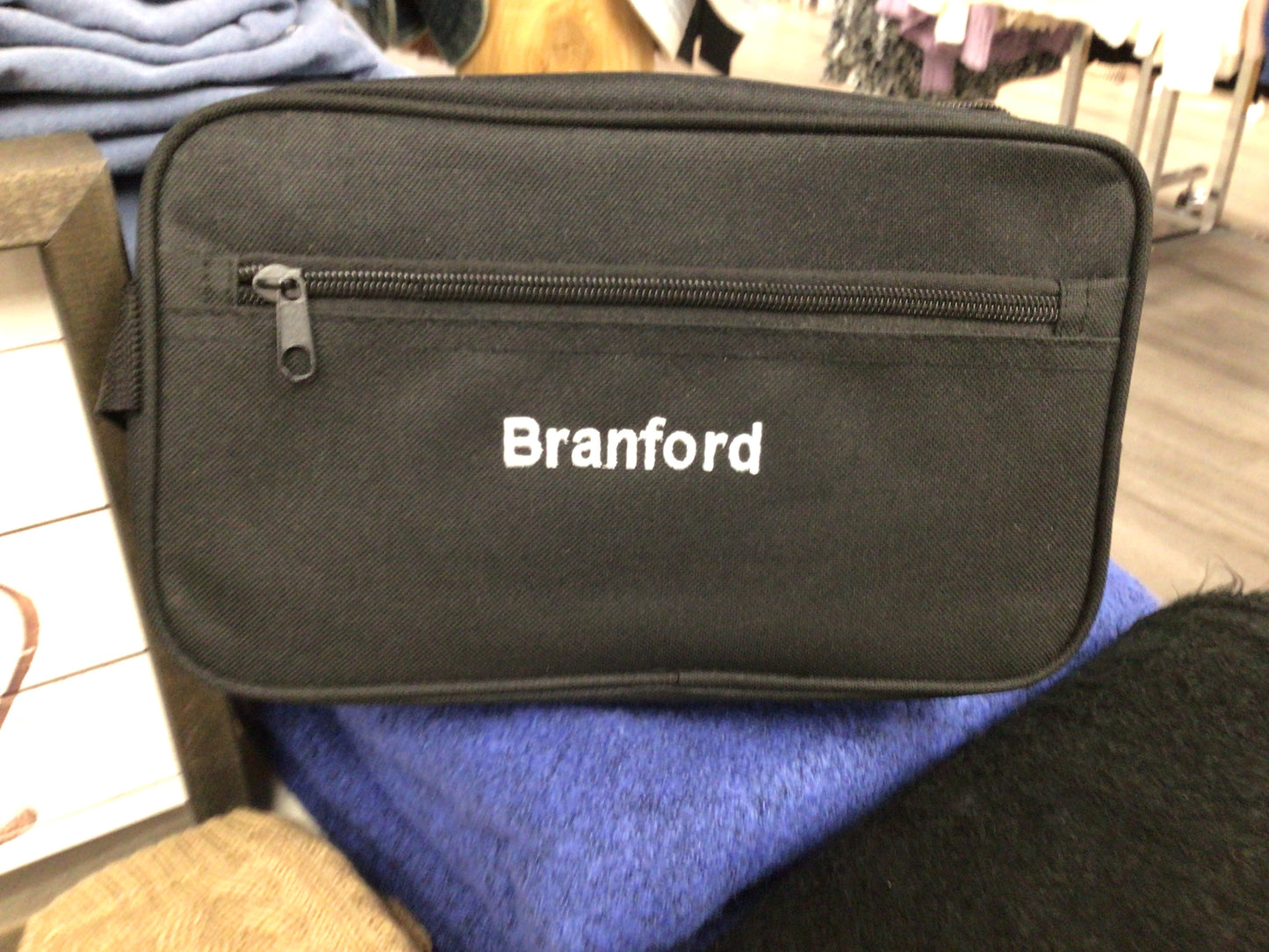Branford CT canvas essentials bag in black. It is 10” wide and 4” deep.
